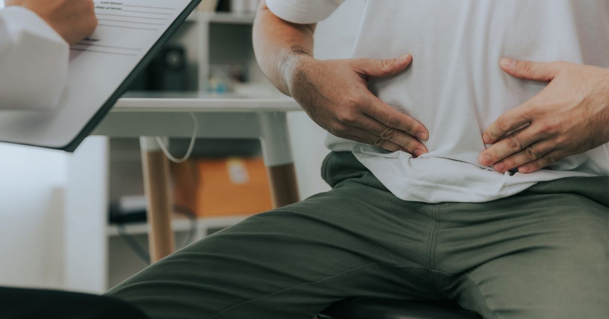 Male Patient explaining symptoms to Doctor